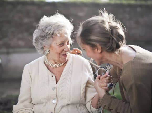 Grandma talking with adult granddaughter